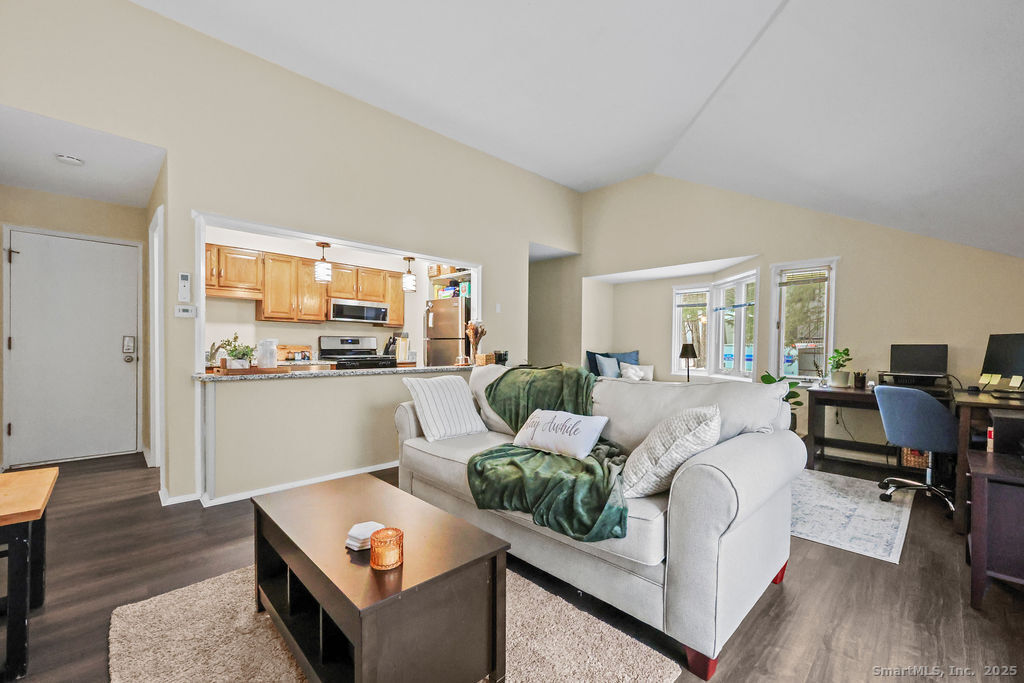 9 Talcott Ridge Road, Unit A4 Farmington, CT 06032 - Photo 4 of 28 a living room with furniture and a wooden floor