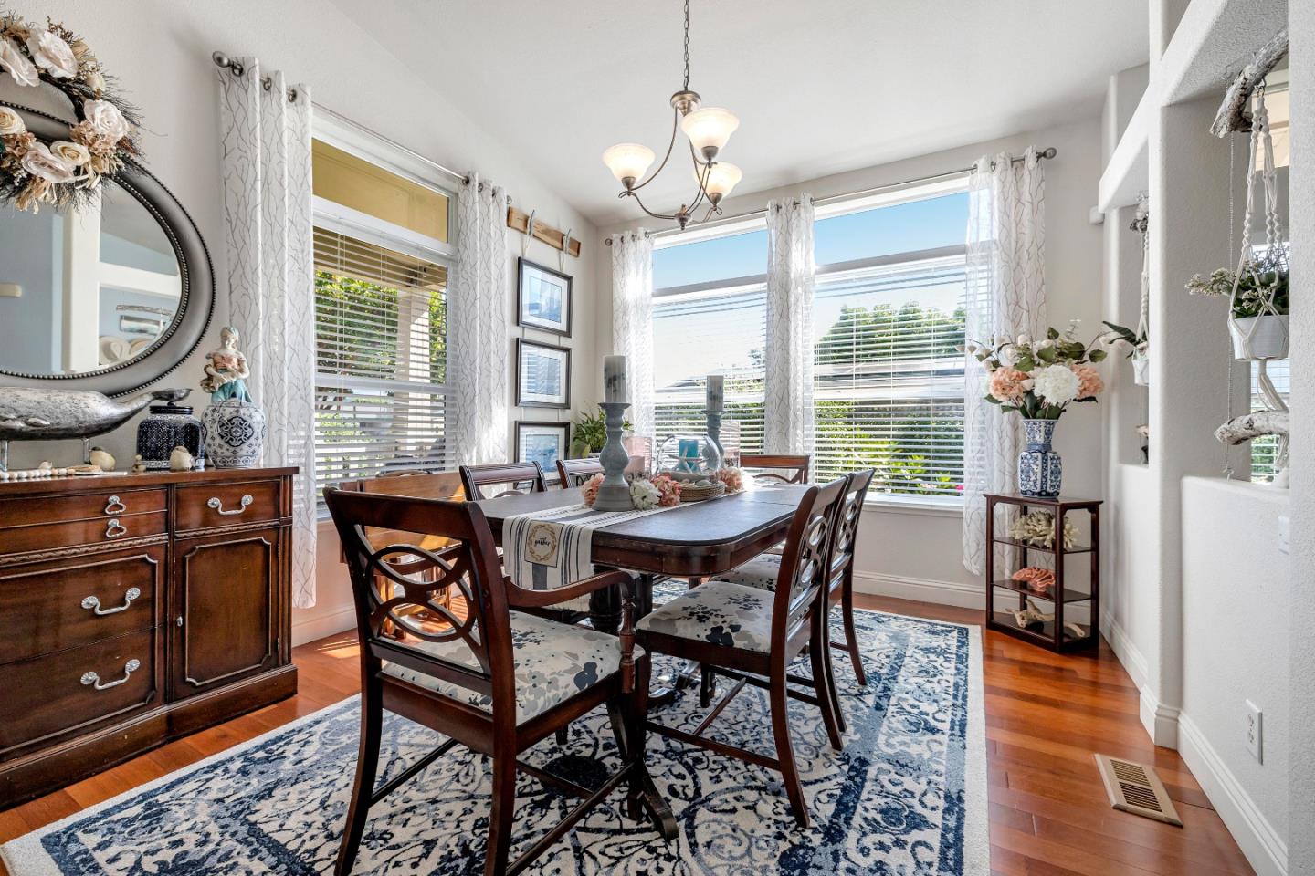 552 Filbert Street Half Moon Bay, CA 94019 - Photo 11 of 34 a view of a dining room with furniture window and wooden floor