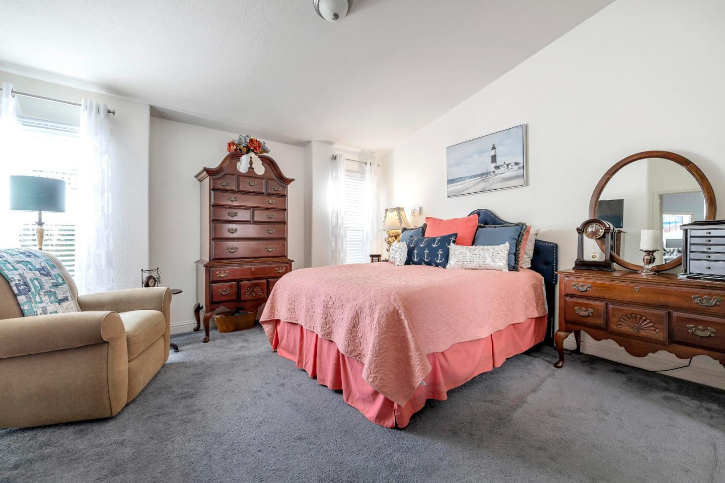 552 Filbert Street Half Moon Bay, CA 94019 - Photo 19 of 34 a spacious bedroom with a bed and a couch