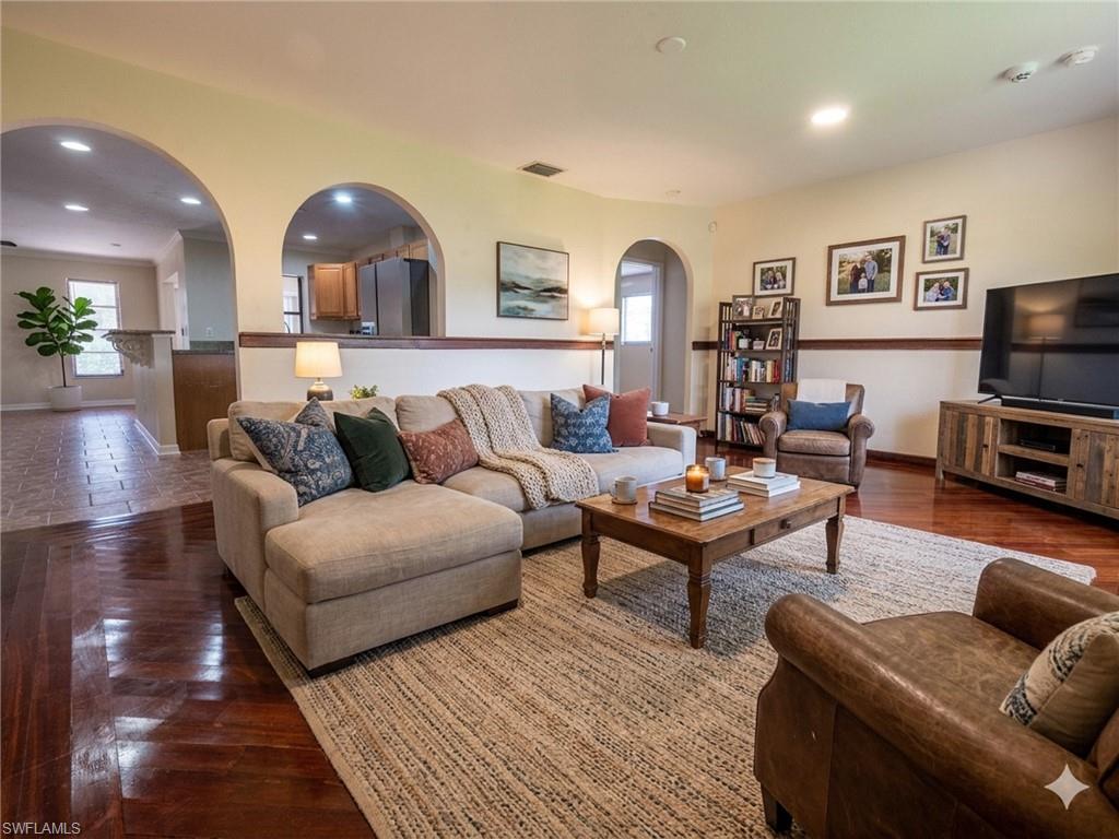 18414 Tulip Road Fort Myers, FL 33967 - Photo 4 of 37 Living area featuring wood-finish flooring, recessed lighting, and a neutral color palette