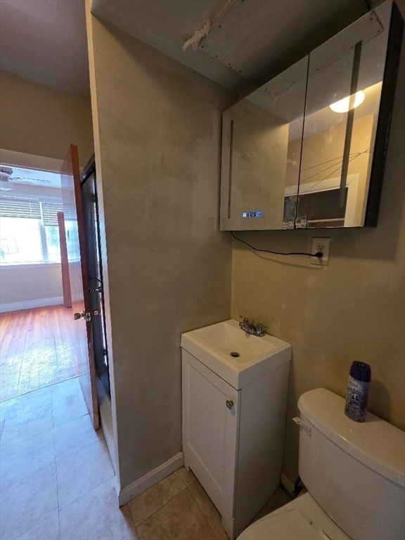 250 Laurel Street Fall River, MA 02724 - Photo 15 of 34 a bathroom with a sink a toilet and mirror