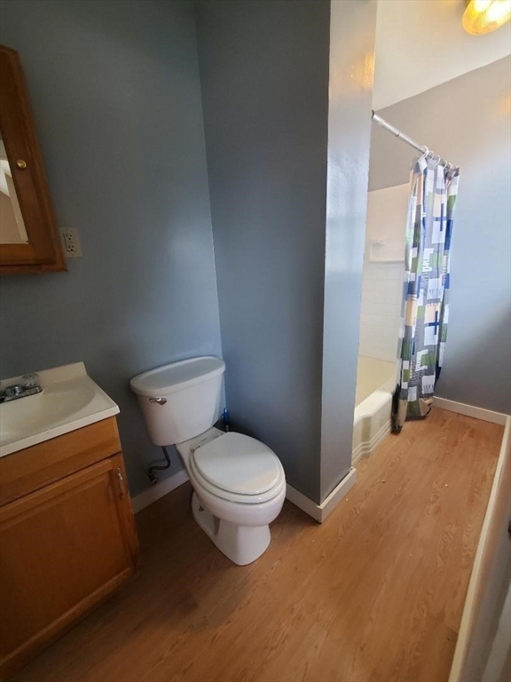 250 Laurel Street Fall River, MA 02724 - Photo 18 of 34 a white toilet sitting next to a bathroom sink