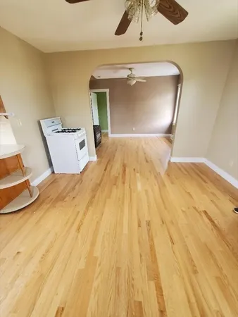 a view of room with wooden floor