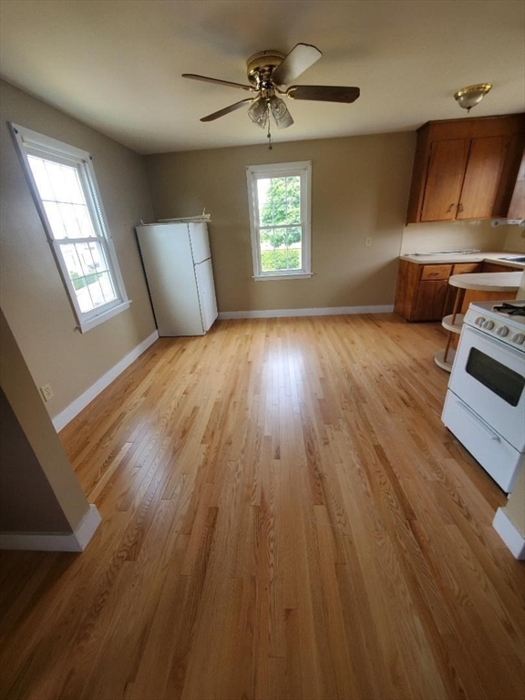 250 Laurel Street Fall River, MA 02724 - Photo 24 of 34 a view of an empty room with a window and wooden floor