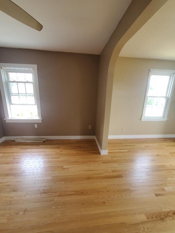 250 Laurel Street Fall River, MA 02724 - Photo 25 of 34 an empty room with wooden floor and windows