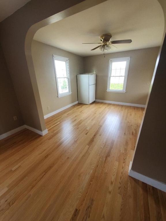 250 Laurel Street Fall River, MA 02724 - Photo 28 of 34 a view of an empty room with a window and wooden floor
