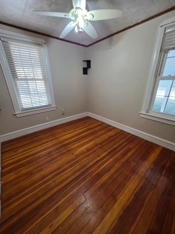 250 Laurel Street Fall River, MA 02724 - Photo 6 of 34 a view of an empty room with wooden floor and a window