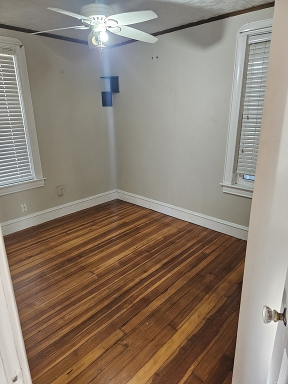 250 Laurel Street Fall River, MA 02724 - Photo 10 of 34 a view of a room with wooden floor and fan