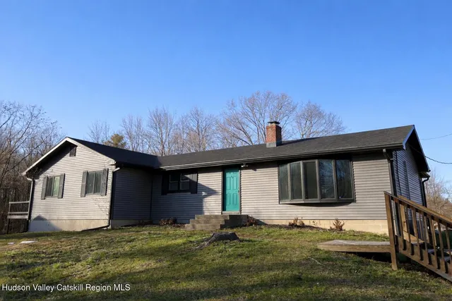 a house with trees in the background