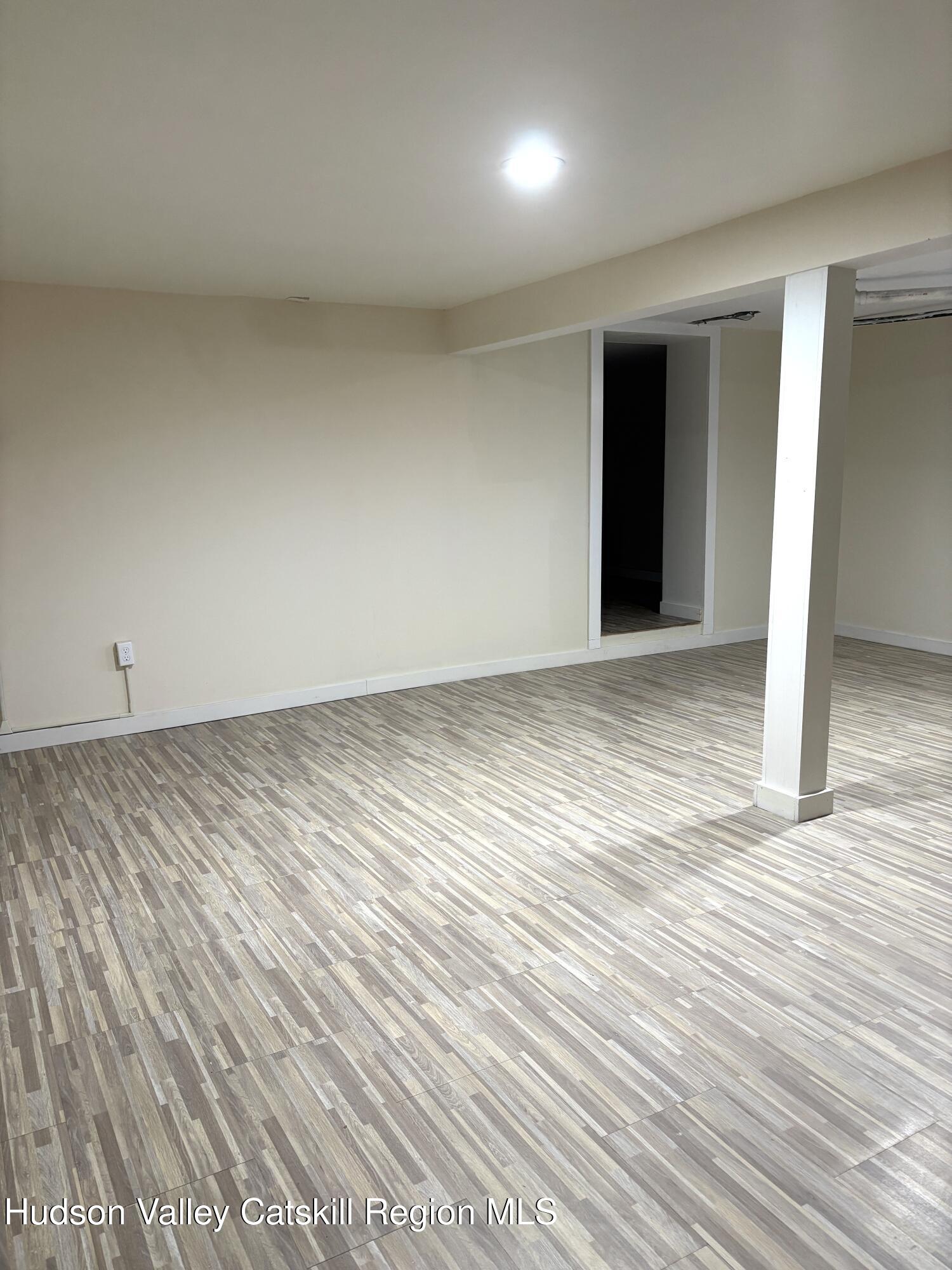 51 Hay Press Road Craryville, NY 12521 - Photo 22 of 27 an empty room with wooden floor and closet