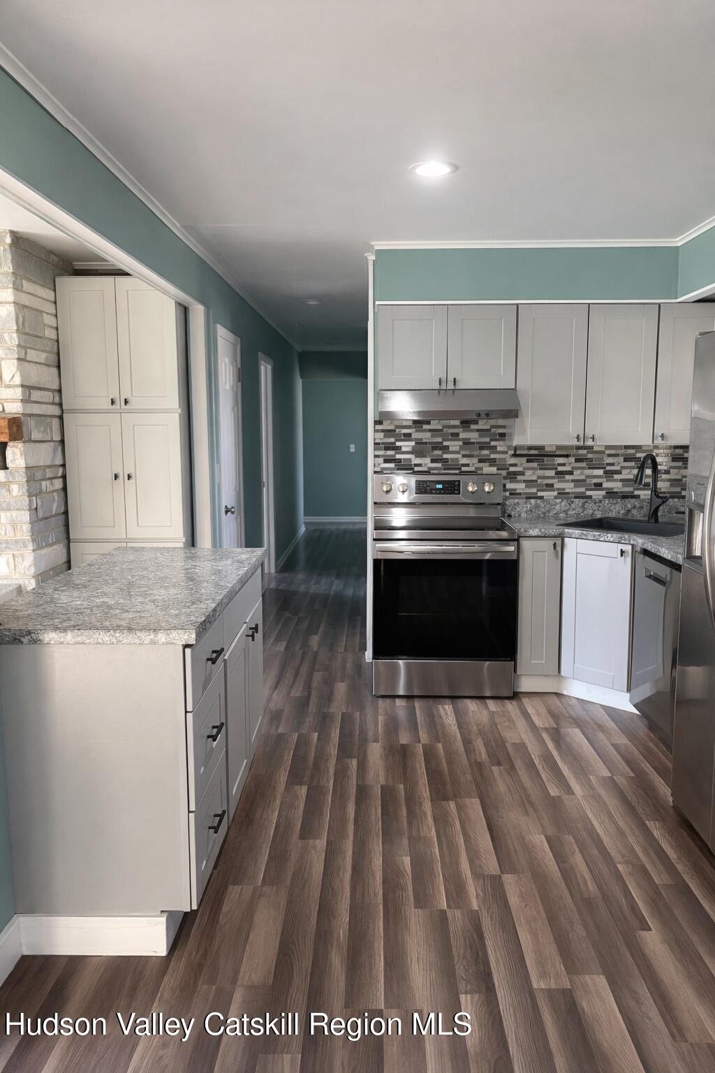51 Hay Press Road Craryville, NY 12521 - Photo 7 of 27 a kitchen with granite countertop a stove top oven and sink
