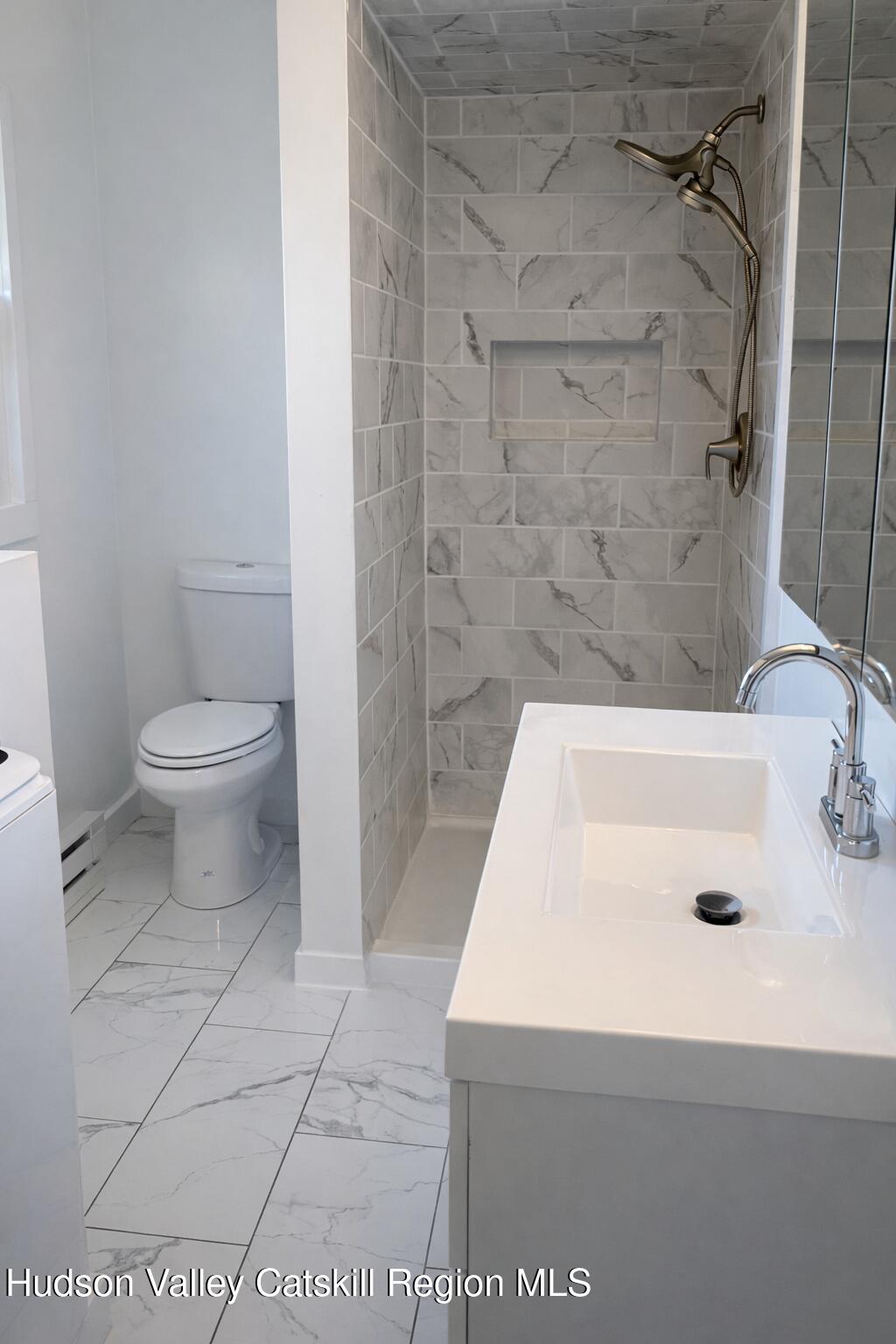 51 Hay Press Road Craryville, NY 12521 - Photo 9 of 27 a bathroom with a sink a toilet and shower