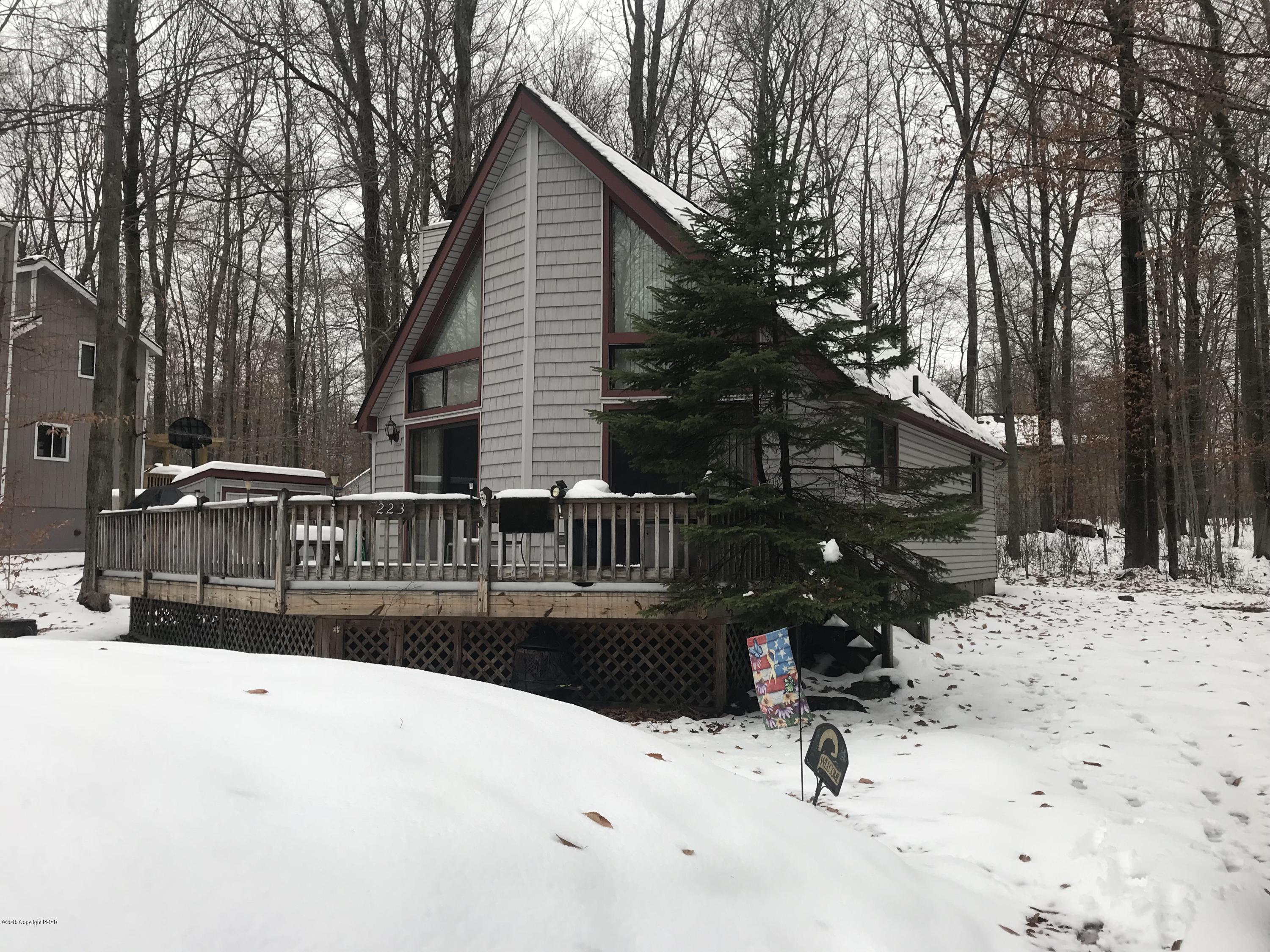 223 Pontiac Path Pocono Lake, PA 18347 - Photo 2 of 13 a view of street with wooden fence