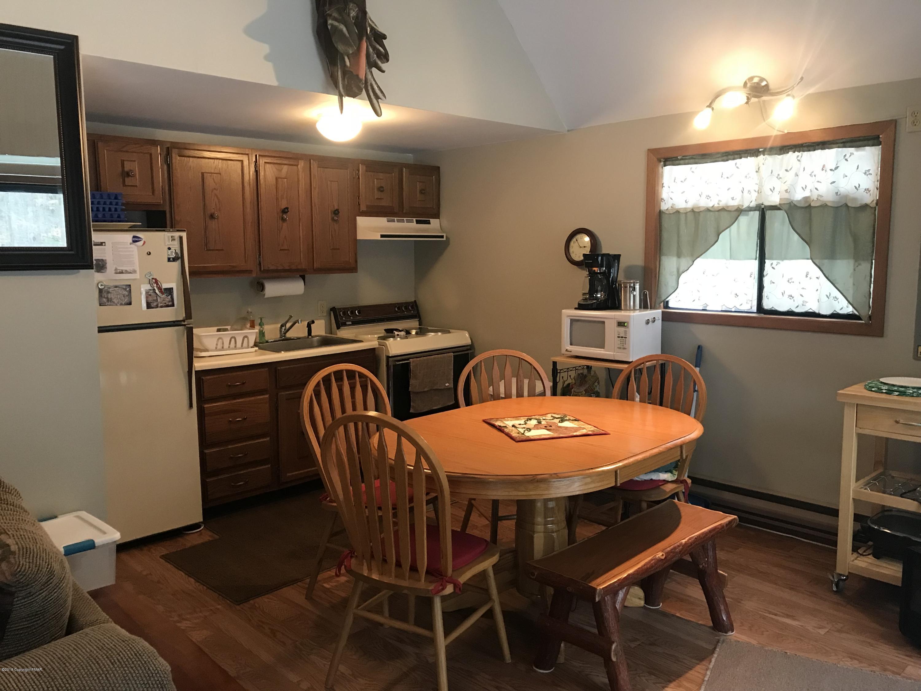 223 Pontiac Path Pocono Lake, PA 18347 - Photo 4 of 13 a dining room with furniture and window