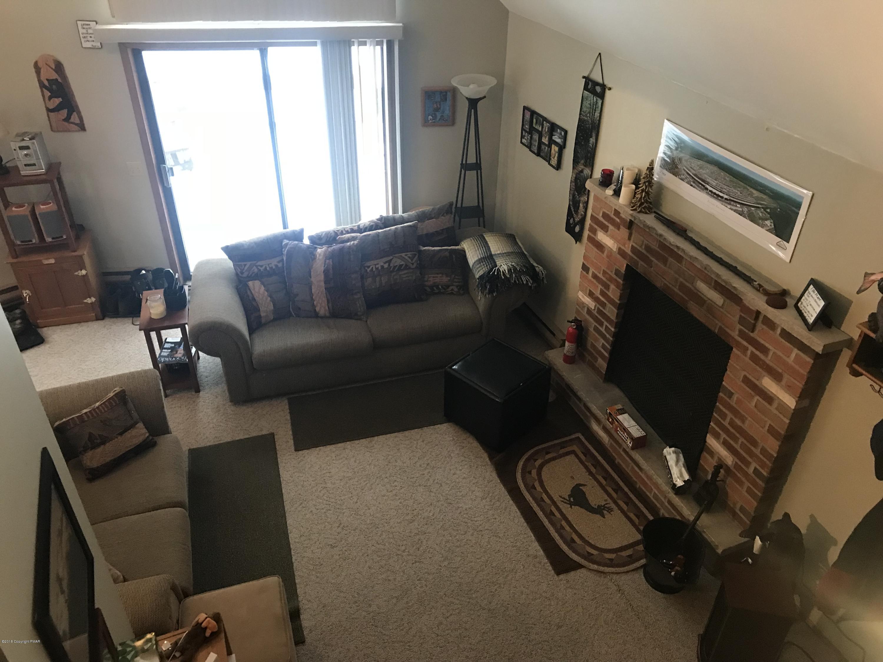 223 Pontiac Path Pocono Lake, PA 18347 - Photo 7 of 13 a living room with furniture and a window