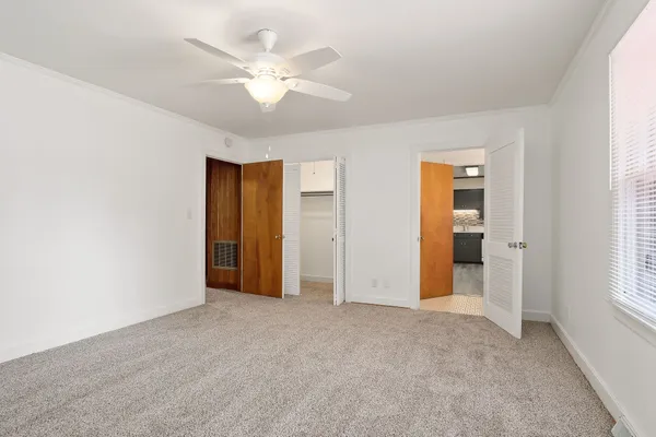 a bathroom with a sink and mirror with toilet
