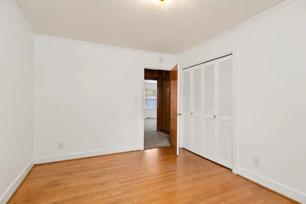 a spacious bathroom with a granite countertop tub shower and sink