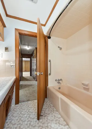 a view of a room with wooden floor