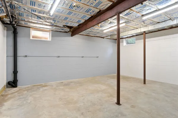 a view of a kitchen with a sink and a window