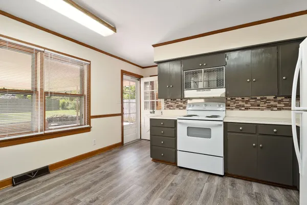 a kitchen with stainless steel appliances granite countertop a stove and a sink