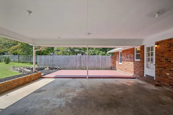 a view of a park with large trees