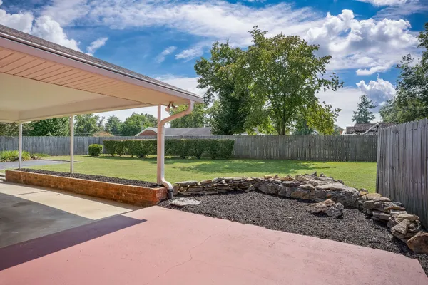 a front view of a house with a garden and porch