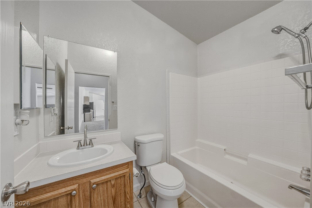 1890 West Dyer Road Pahrump, NV 89048 - Photo 24 of 40 This functional bathroom provides a comfortable and clean space with essential amenities for daily routines.