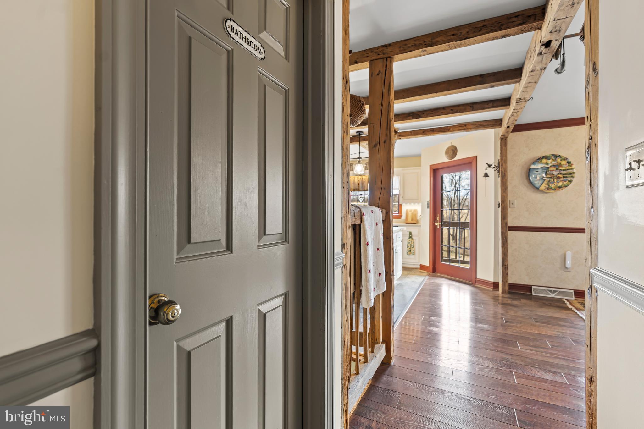 11625 Walnut Point Road Hagerstown, MD 21740 - Photo 31 of 118 a view of a hallway with wooden floor and staircase
