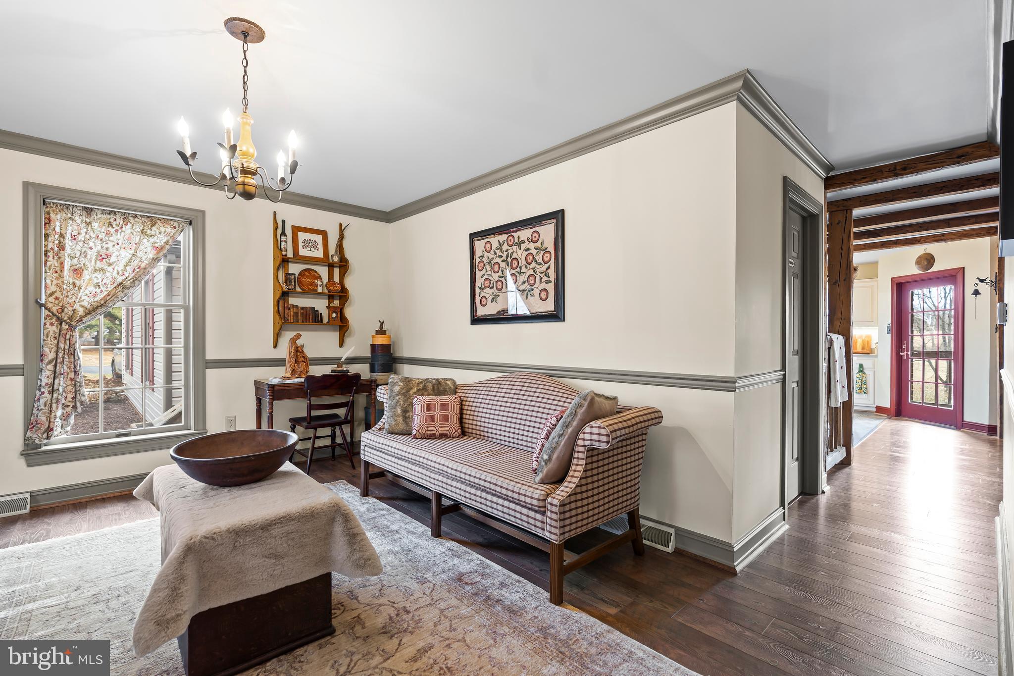 11625 Walnut Point Road Hagerstown, MD 21740 - Photo 33 of 118 a living room with furniture and a chandelier