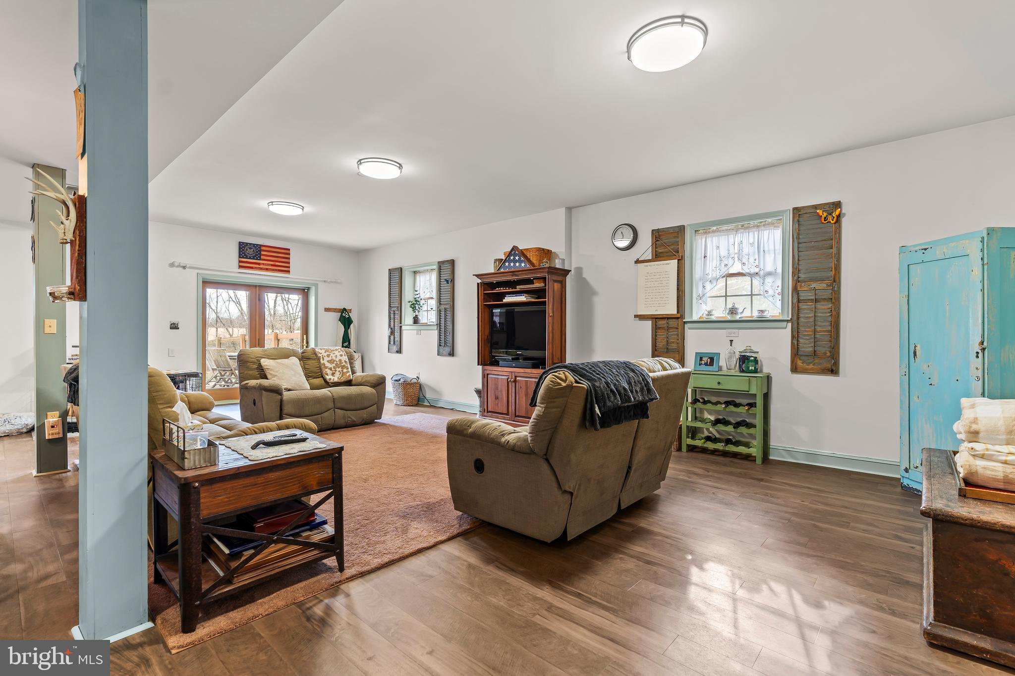 11625 Walnut Point Road Hagerstown, MD 21740 - Photo 63 of 118 a living room with furniture and a flat screen tv