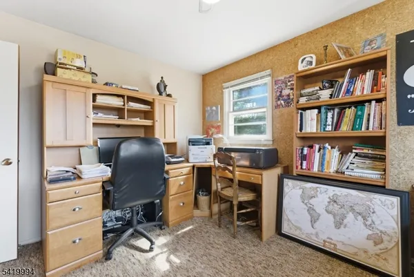 a view of a workspace with furniture and toys