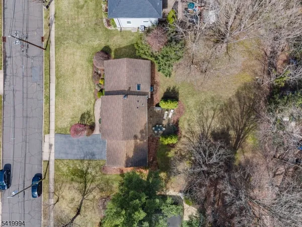 an aerial view of residential house with outdoor space and parking