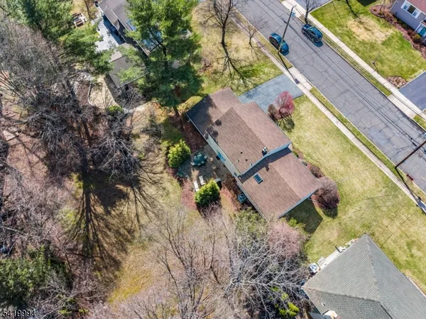 an aerial view of a house with a garden