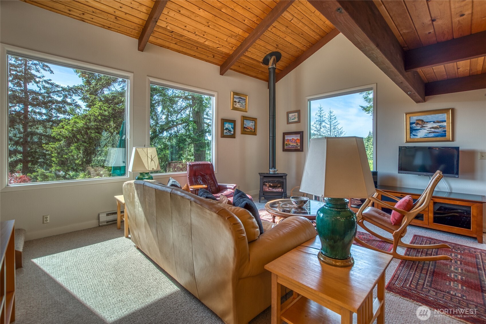 402 Cayou Valley Road Orcas Island, WA 98245 - Photo 20 of 40 a living room with furniture a flat screen tv and a large window
