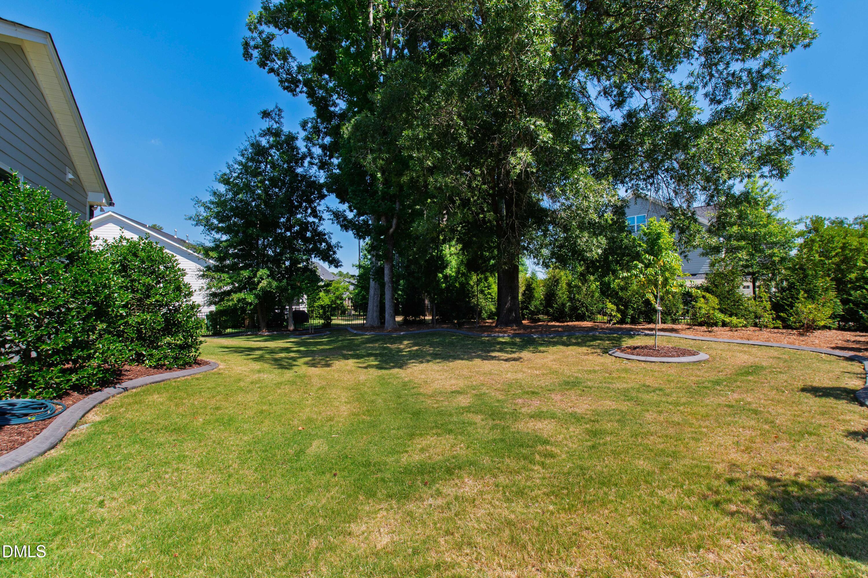 1300 Commons Ford Place Apex, NC 27539 - Photo 60 of 70 a view of a swimming pool with an outdoor space and seating area