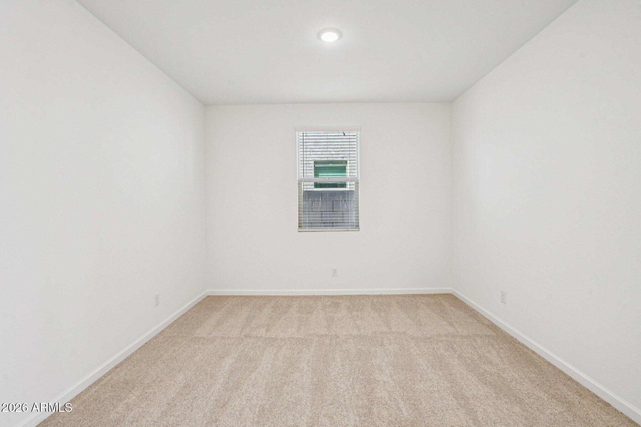 47638 West Moeller Road Maricopa, AZ 85139 - Photo 15 of 56 an empty room with a window