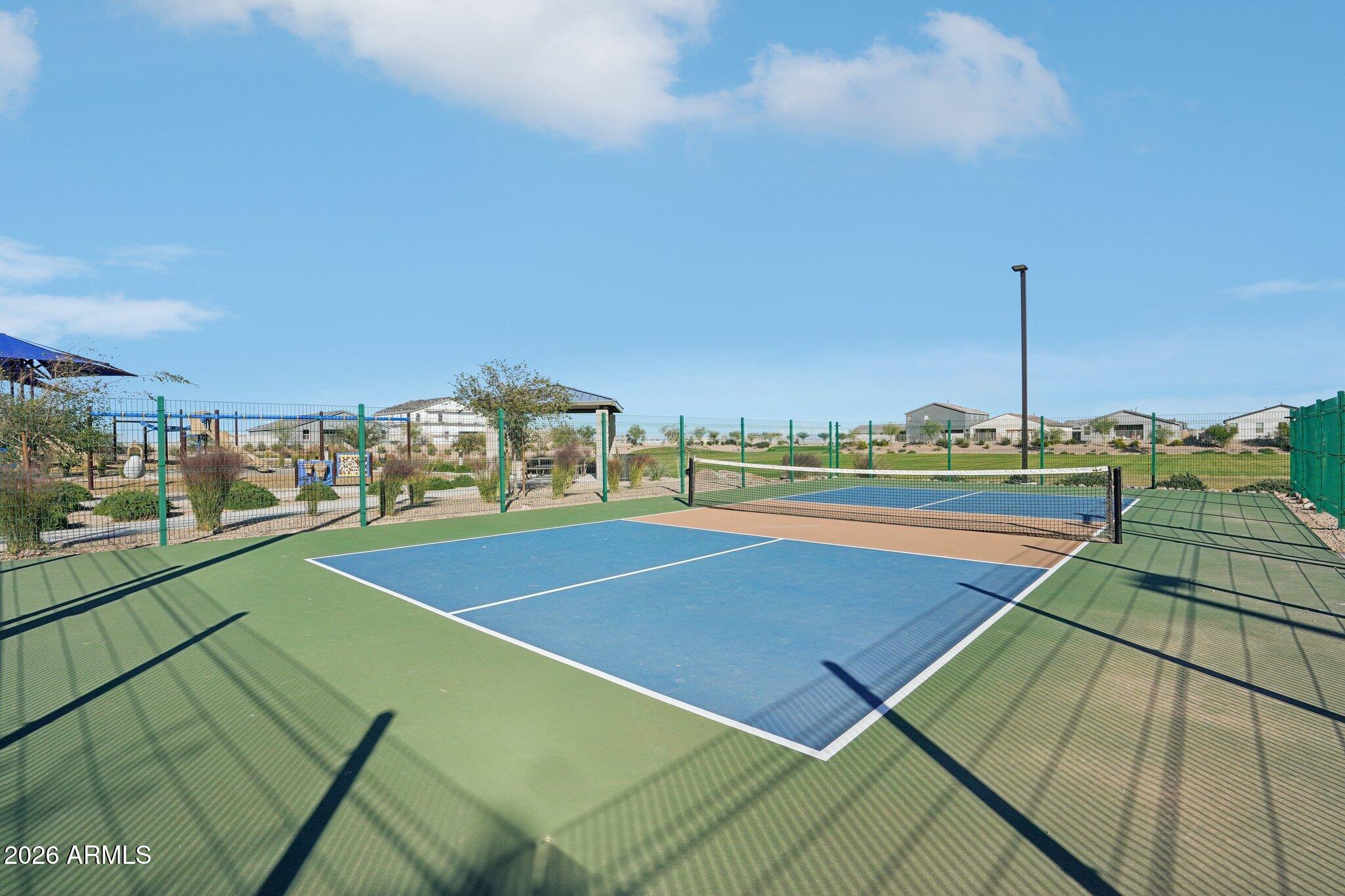 47638 West Moeller Road Maricopa, AZ 85139 - Photo 16 of 56 a view of an outdoor space and tennis court