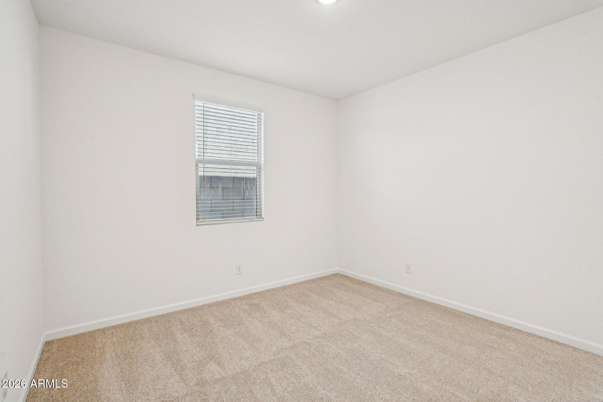 47638 West Moeller Road Maricopa, AZ 85139 - Photo 17 of 56 an empty room with a window