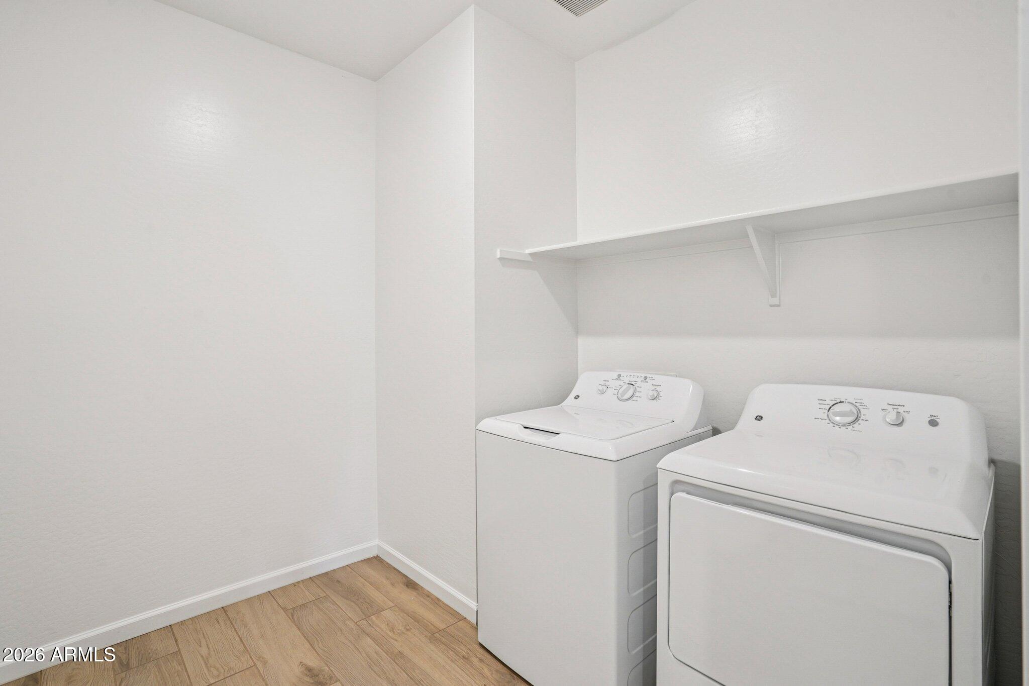 47638 West Moeller Road Maricopa, AZ 85139 - Photo 18 of 56 a view of storage and utility room with washer and dryer