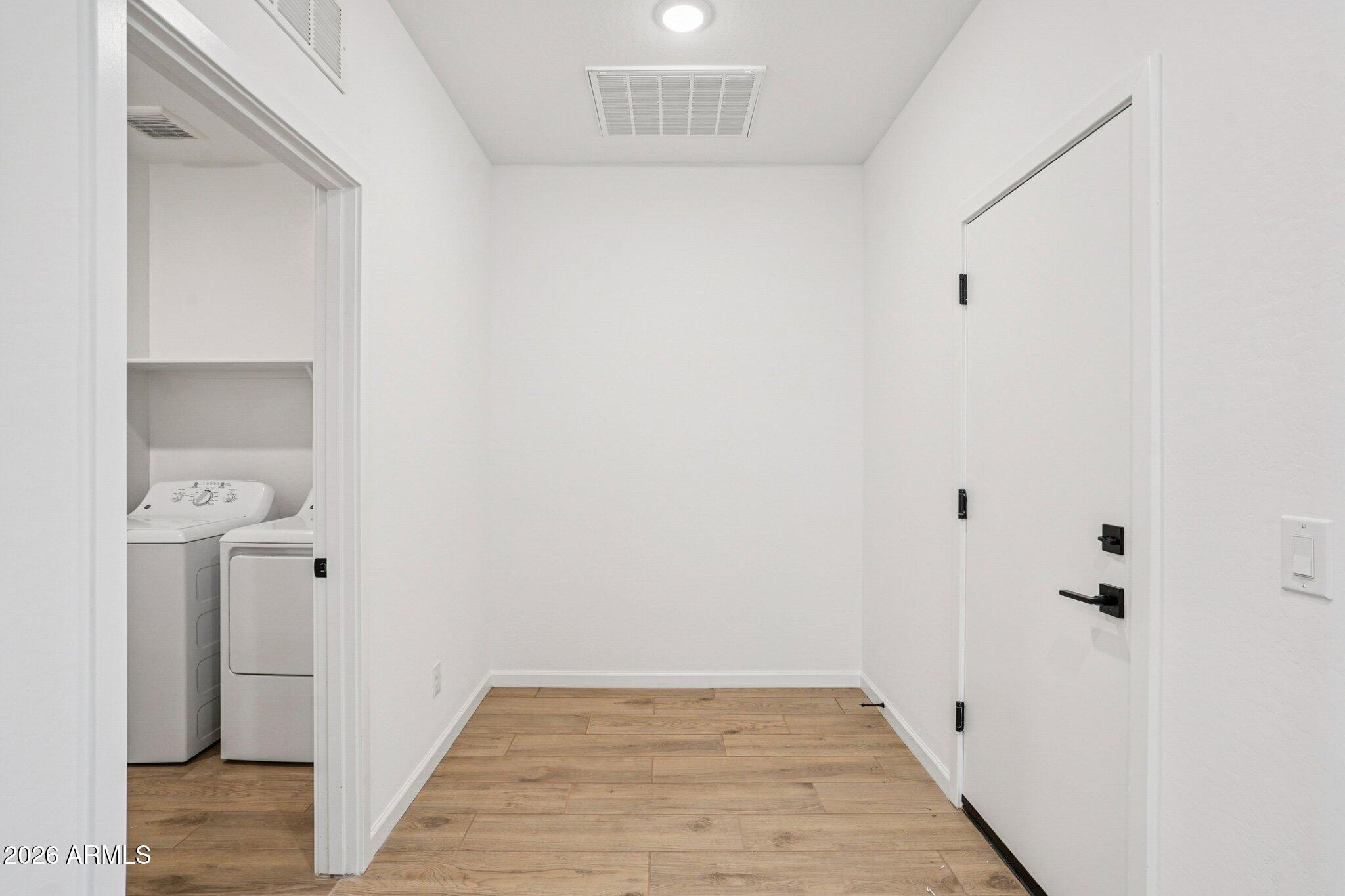 47638 West Moeller Road Maricopa, AZ 85139 - Photo 20 of 56 a view of a room with wooden floor