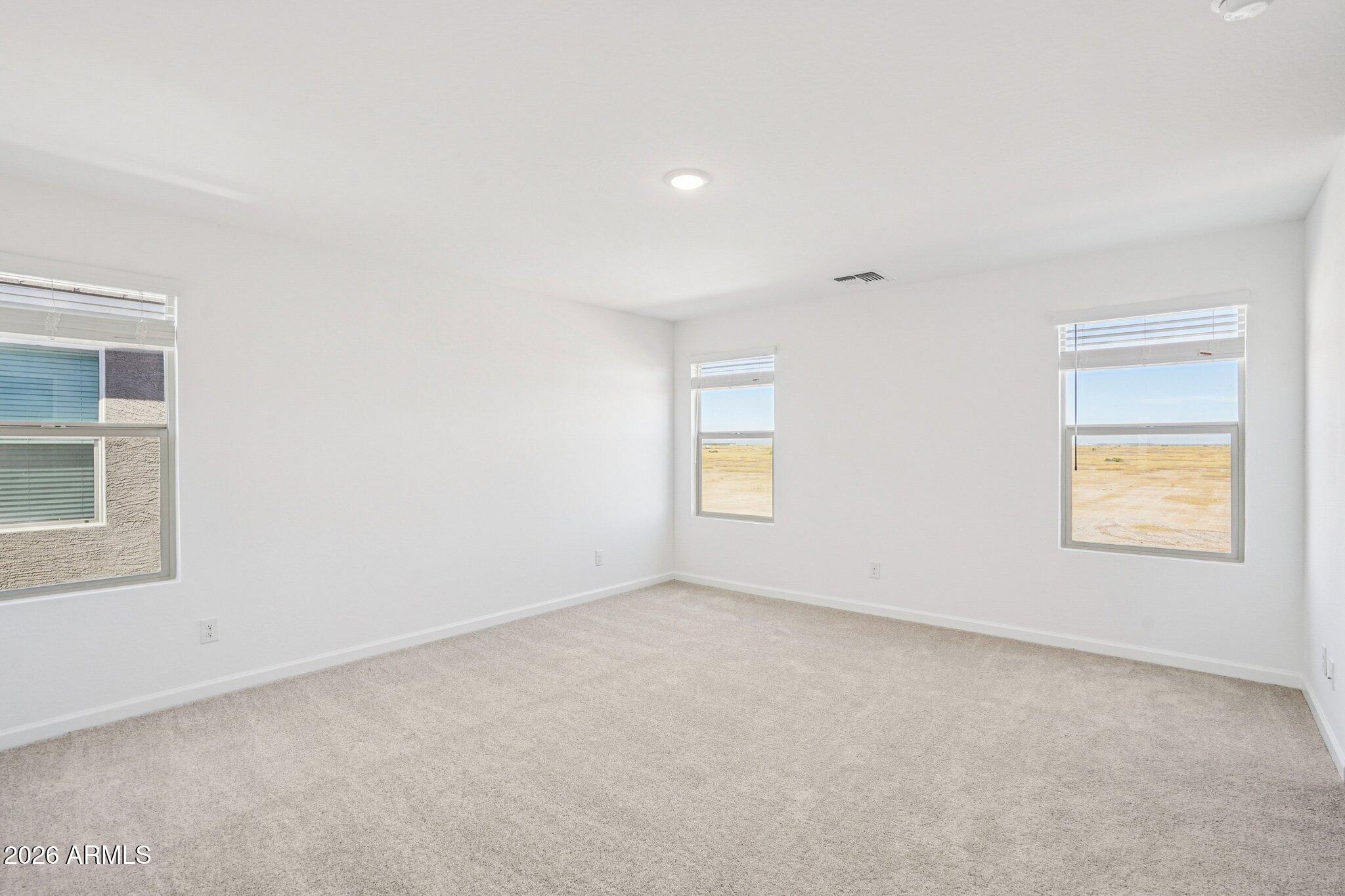 47638 West Moeller Road Maricopa, AZ 85139 - Photo 23 of 56 an empty room with windows