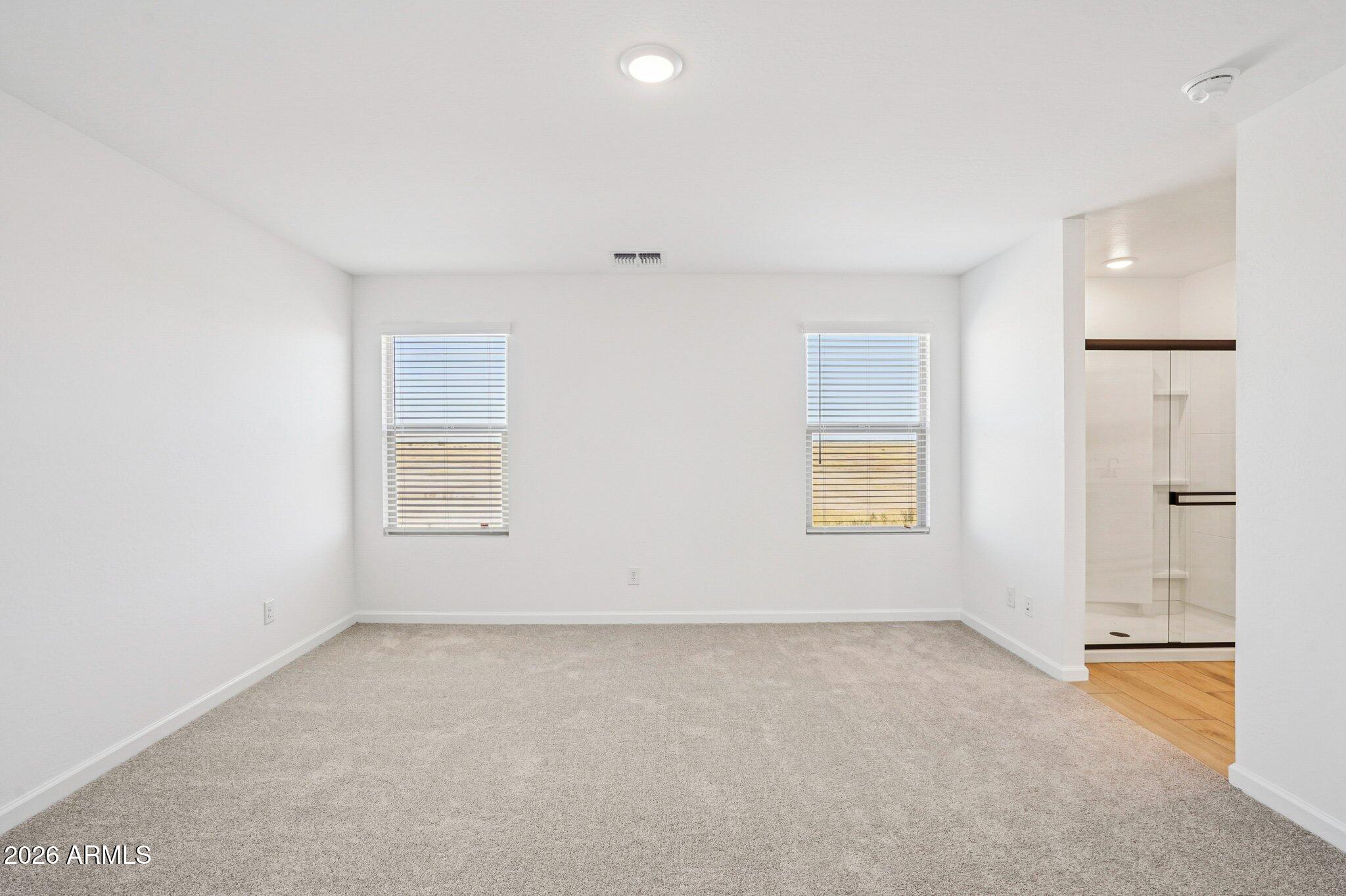 47638 West Moeller Road Maricopa, AZ 85139 - Photo 27 of 56 an empty room with windows and closet