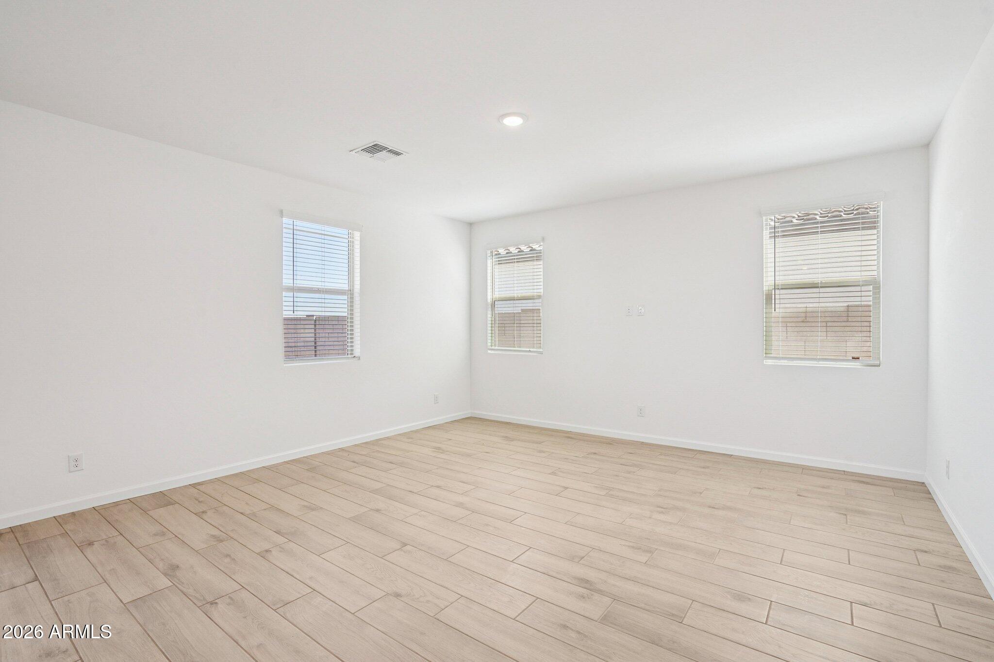 47638 West Moeller Road Maricopa, AZ 85139 - Photo 3 of 56 an empty room with windows