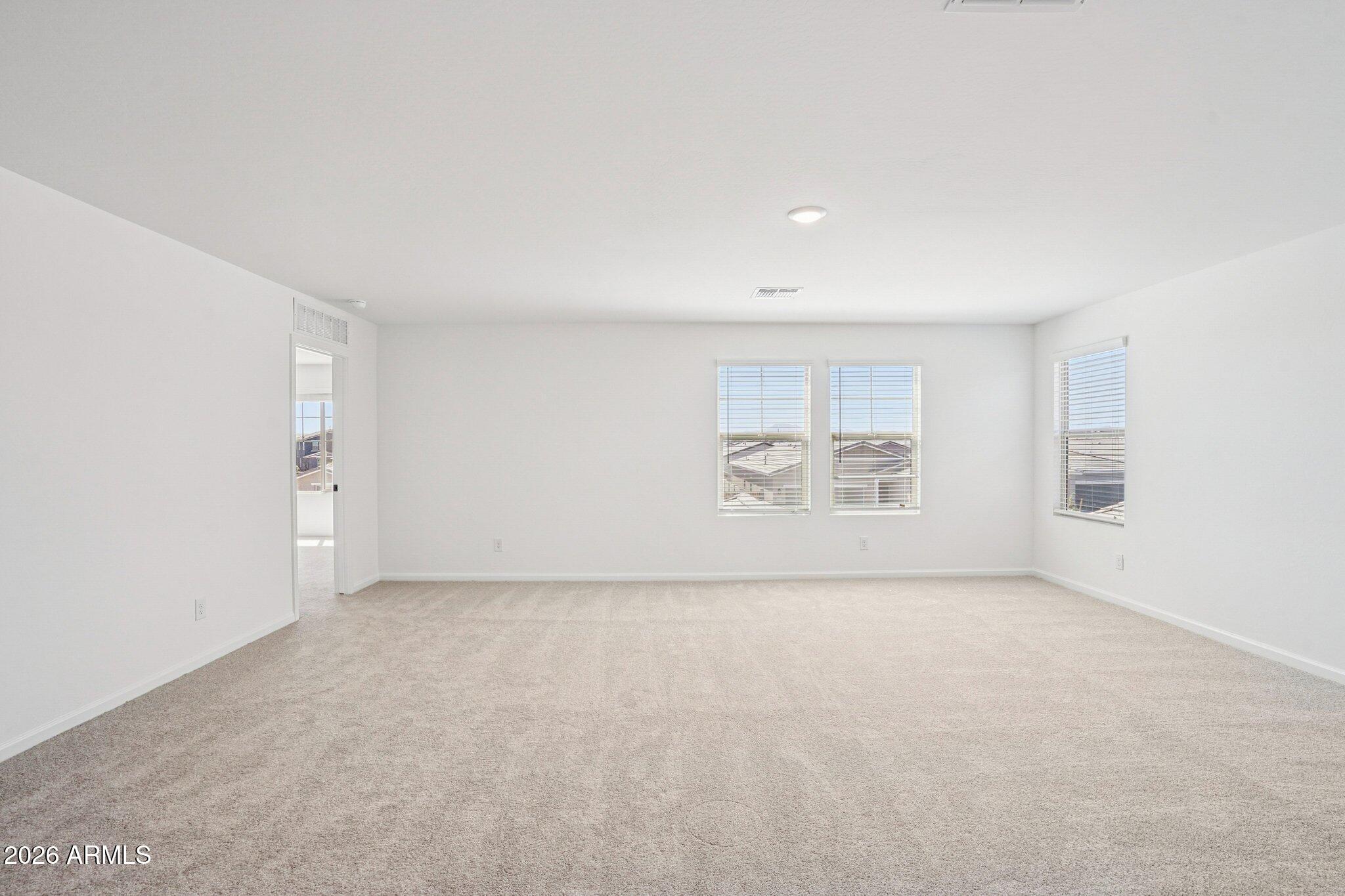 47638 West Moeller Road Maricopa, AZ 85139 - Photo 38 of 56 an empty room with a empty space and window