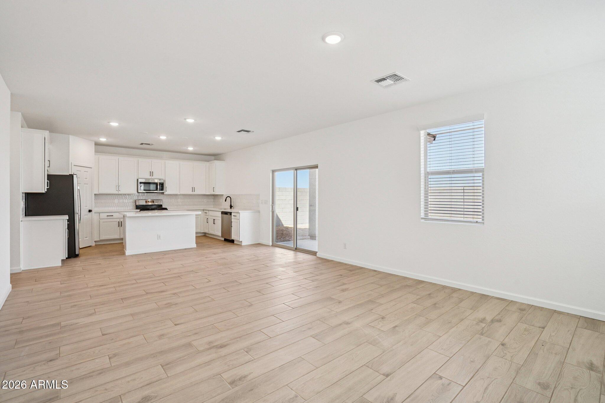 47638 West Moeller Road Maricopa, AZ 85139 - Photo 4 of 56 a view of kitchen with wooden floor