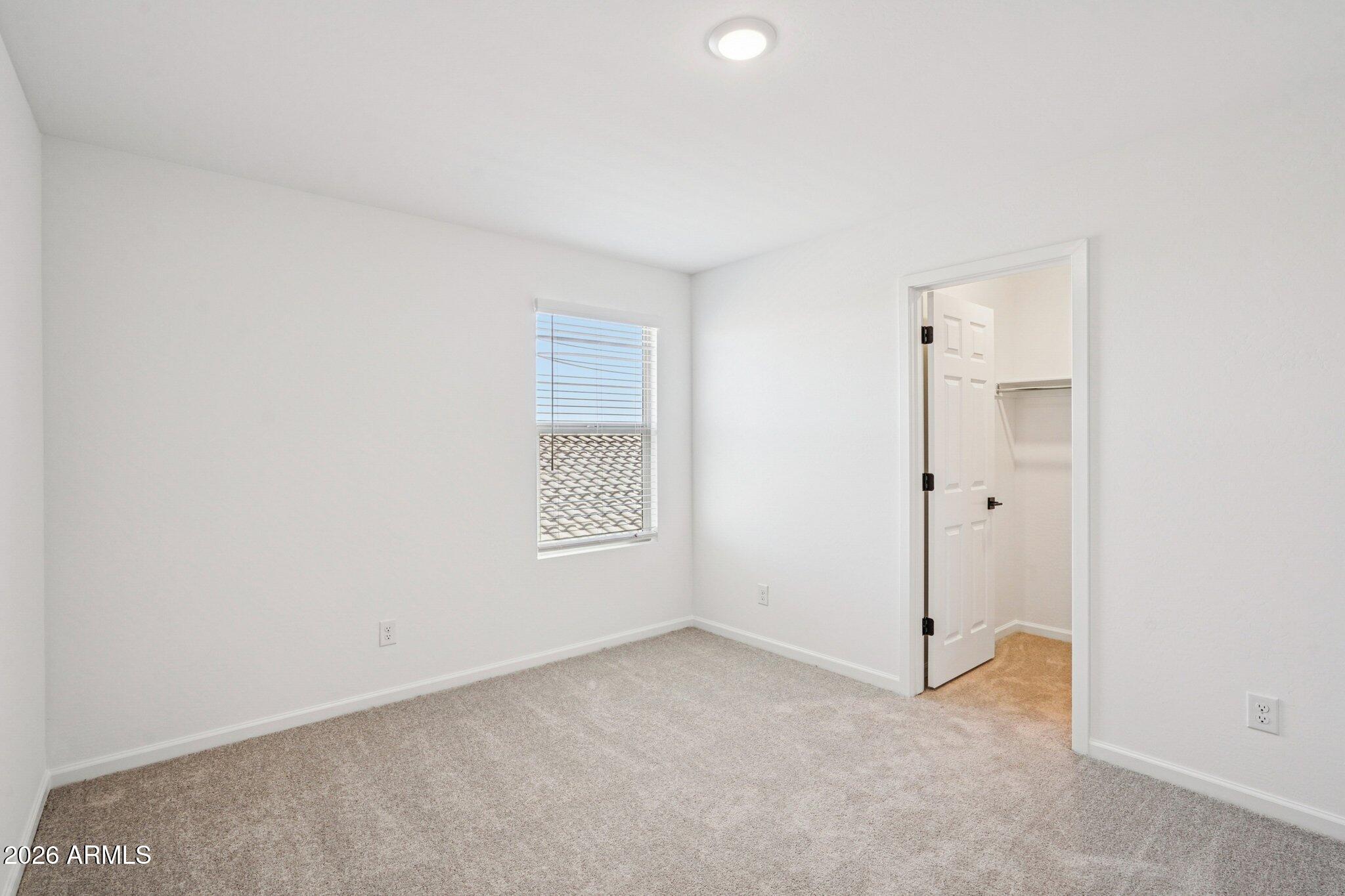 47638 West Moeller Road Maricopa, AZ 85139 - Photo 44 of 56 an empty room with a empty space and a window