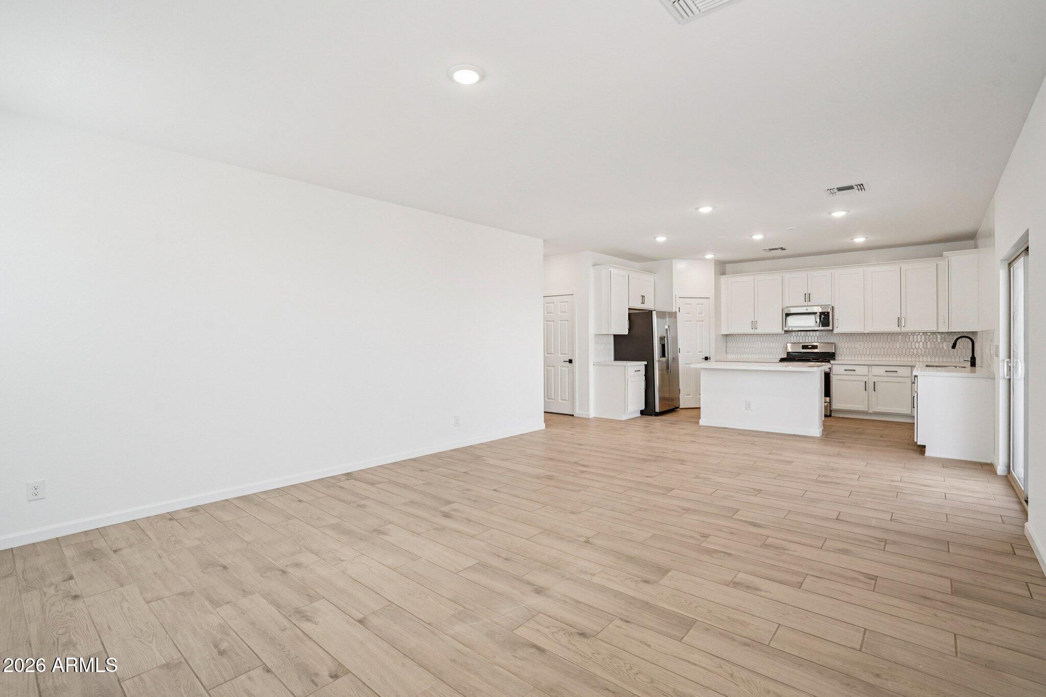 47638 West Moeller Road Maricopa, AZ 85139 - Photo 5 of 56 a view of kitchen with wooden floor
