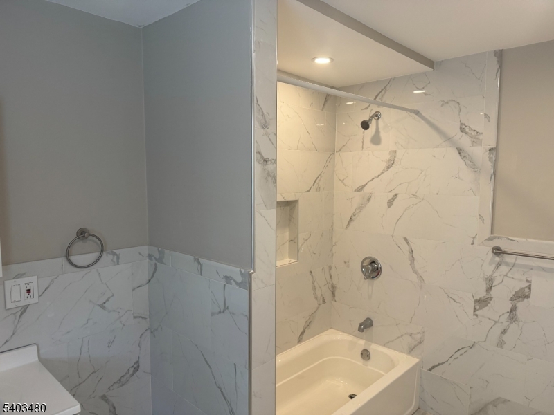 375 Tower Street Union, NJ 07088 - Photo 9 of 10 a bathroom with a bathtub and shower