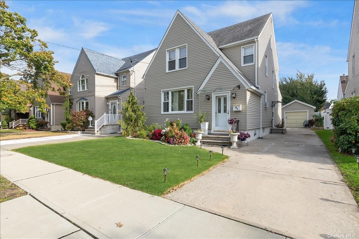 42 Kenmore Road Valley Stream, NY 11581 - Photo 1 of 1 a front view of house with yard and green space