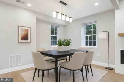 a view of a dining room with furniture and window